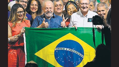 Elected president and vice-president for the leftist Workers Party (PT) Luiz Inacio Lula da Silva (C) and Geraldo Alckmin (R) celebrate after winning the presidential run-off election, in Sao Paulo, Brazil, on October 30, 2022 (AFP) Elected president and vice-president for the leftist Workers Party (PT) Luiz Inacio Lula da Silva (C) and Geraldo Alckmin (R) celebrate after winning the presidential run-off election, in Sao Paulo, Brazil, on October 30, 2022 (AFP)