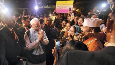 Prime Minister Narendra Modi being greeted by Indian community after arriving in Bali to attend the G20 Summit, on Monday. (PTI) Prime Minister Narendra Modi being greeted by Indian community after arriving in Bali to attend the G20 Summit, on Monday. (PTI)