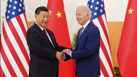 U.S. President Joe Biden shakes hands with Chinese President Xi Jinping as they meet on the sidelines of the G20 leaders' summit in Bali, Indonesia, November 14, 2022. (REUTERS)