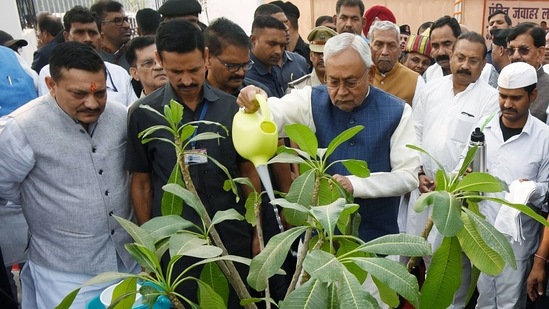 Bihar Chief Minister Nitish Kumar waters a sapling during the programme on the 133rd birth anniversary of Jawaharlal Nehru at Nehru Park in Patna. State Governor Phagu Chauhan was also present at the ceremony.(ANI)