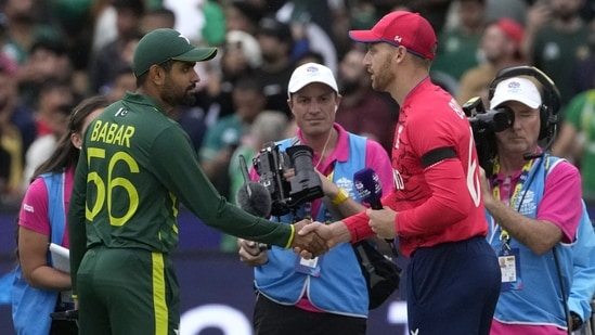 Pakistan's captain Babar Azam, center left, shakes hands with England's captain Jos Buttler at the toss (AP)