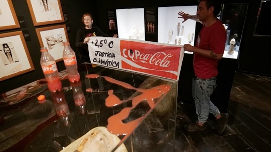 Climate activists of 'Futuro Vegetal' pose after throwing 'syrup and beetroot juice' to resemble petrol and blood at the Egyptian Museum in Barcelona, Spain.(Futuro Vegetal/via REUTERS )