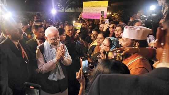 Prime Minister Narendra Modi being greeted by Indian community after arriving in Bali to attend the G20 Summit, on Monday. (PTI) Prime Minister Narendra Modi being greeted by Indian community after arriving in Bali to attend the G20 Summit, on Monday. (PTI)