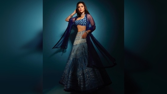 Nushrratt Bharuccha opted for the subtle glam makeup look with bold blue smokey eyes and nude lips.(Instagram/@nushrrattbharuccha)