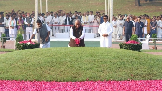 Congress president Mallikarjun Kharge pays floral tributes to Nehru at Shantivan memorial, Delhi, on Monday.(@INCIndia/ Twitter)