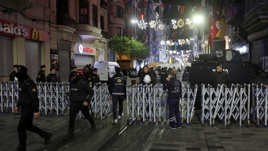 Members of the security forces stand near the scene after an explosion on busy pedestrian Istiklal street in Istanbul, Turkey, November 13, 2022. (REUTERS/Umit Bektas)