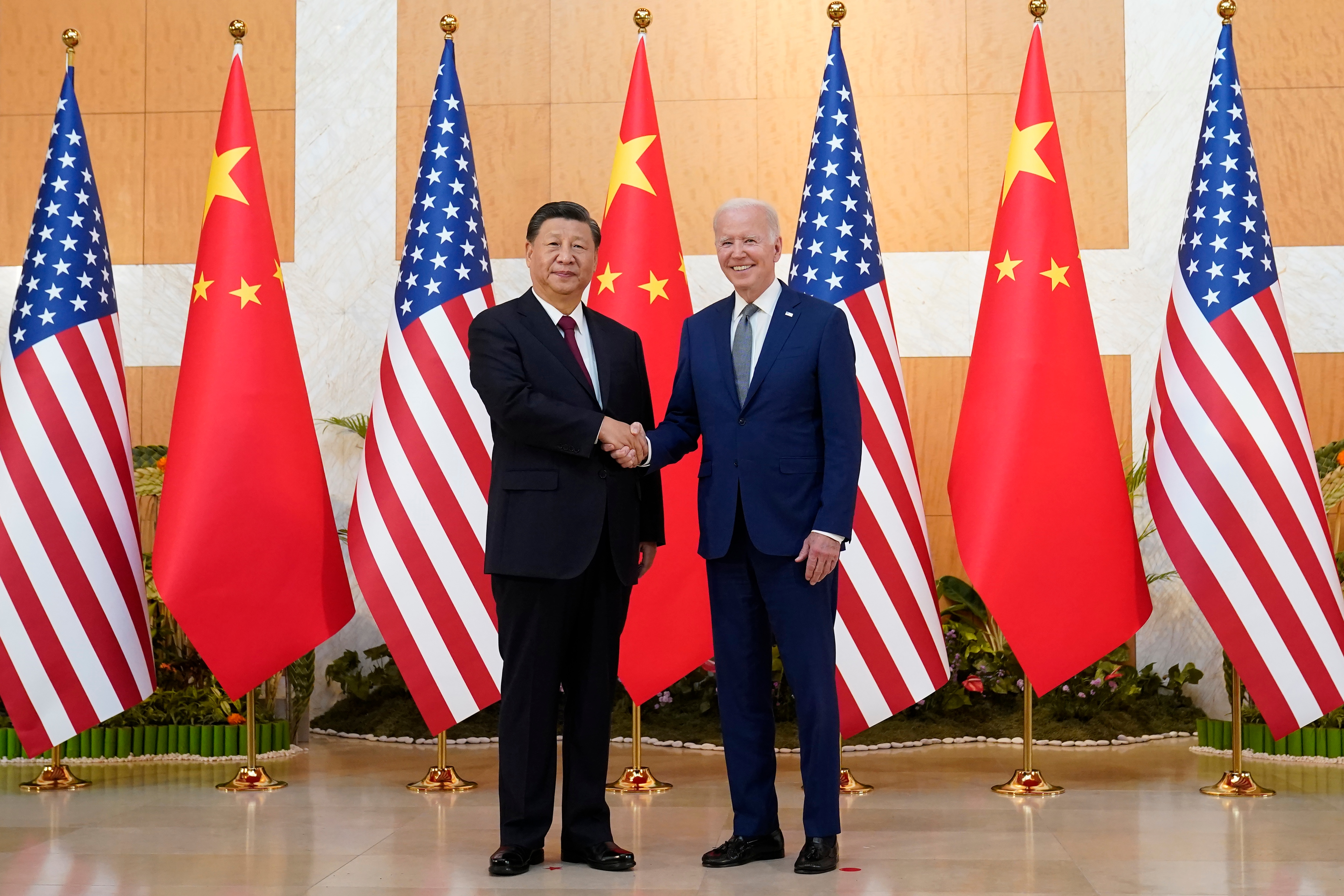 US President Joe Biden shakes hands with Chinese President Xi Jinping. (AP) US President Joe Biden shakes hands with Chinese President Xi Jinping. (AP)