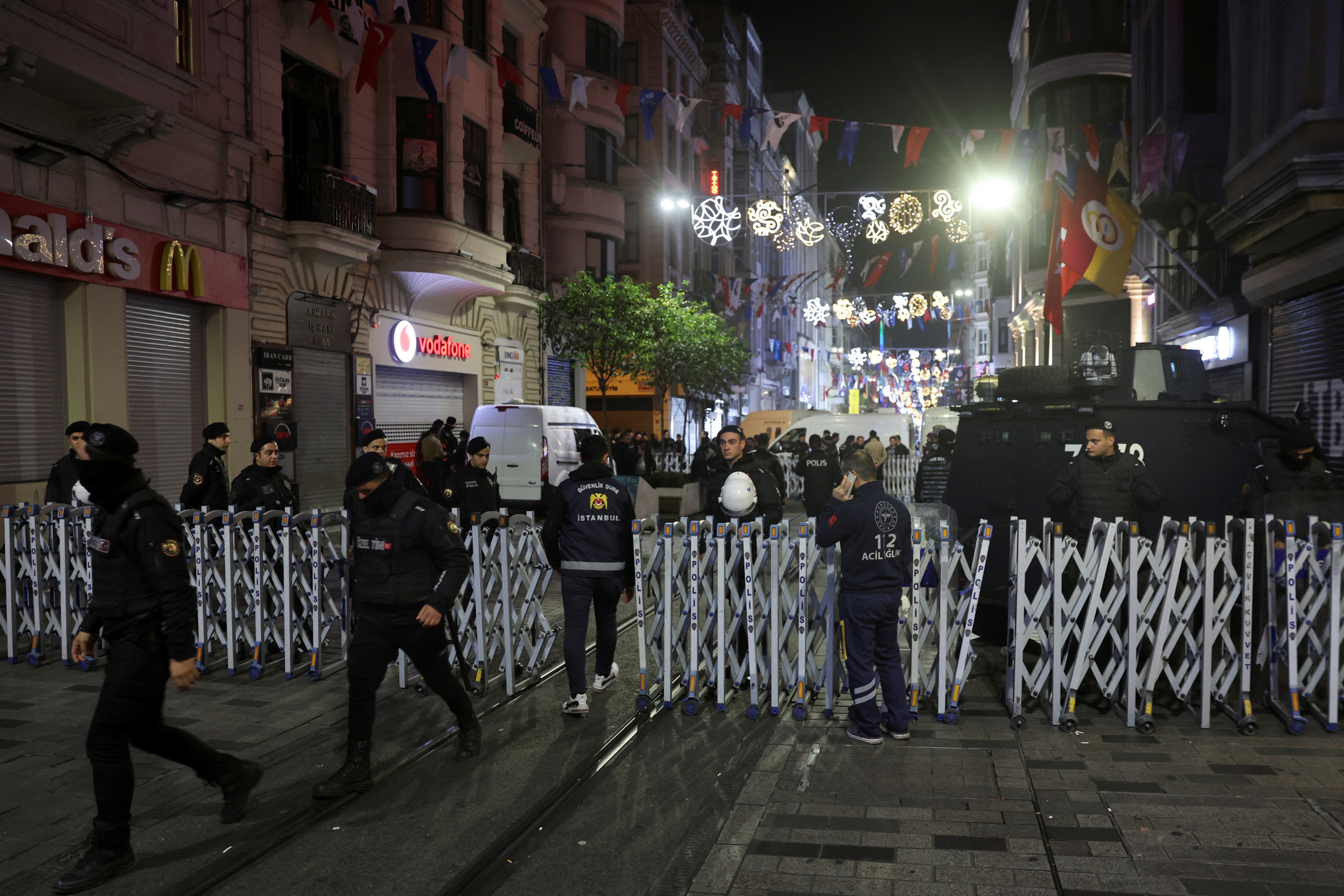 Members of the security forces stand near the scene after an explosion on busy pedestrian Istiklal street in Istanbul, Turkey, November 13, 2022. (REUTERS/Umit Bektas)