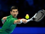 Serbia's Novak Djokovic returns the ball to Greece's Stefanos Tsitsipas during their singles tennis match of the ATP World Tour Finals, at the Pala Alpitour in Turin, Italy, Monday, Nov. 14, 2022.AP/PTI Photo(AP11_15_2022_000025B)(AP) Serbia's Novak Djokovic returns the ball to Greece's Stefanos Tsitsipas during their singles tennis match of the ATP World Tour Finals, at the Pala Alpitour in Turin, Italy, Monday, Nov. 14, 2022.AP/PTI Photo(AP11_15_2022_000025B)(AP)