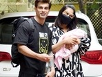 Bipasha Basu and Karan Singh Grover with their newborn daughter Devi outside their house on Tuesday.(Yogen Shah) Bipasha Basu and Karan Singh Grover with their newborn daughter Devi outside their house on Tuesday.(Yogen Shah)