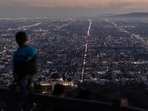 World Population: A boy takes in the view of the Los Angeles skyline. World Population: A boy takes in the view of the Los Angeles skyline.