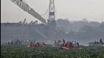 Rescuers search for survivors on October 31 after a suspension bridge collapsed in Gujarat’s Morbi. (REUTERS Photo) Rescuers search for survivors on October 31 after a suspension bridge collapsed in Gujarat’s Morbi. (REUTERS Photo)