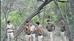 Police officers look for Walkar’s body parts in a forested area in Chhatarpur on Tuesday. (HT Photo) Police officers look for Walkar’s body parts in a forested area in Chhatarpur on Tuesday. (HT Photo)