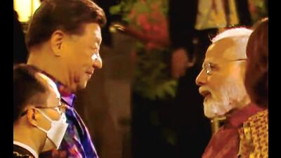 Prime Minister Narendra Modi and Chinese President Xi Jinping shook hands and spoke briefly at a formal dinner for G20 leaders in Bali on Tuesday. (PTI) Prime Minister Narendra Modi and Chinese President Xi Jinping shook hands and spoke briefly at a formal dinner for G20 leaders in Bali on Tuesday. (PTI)