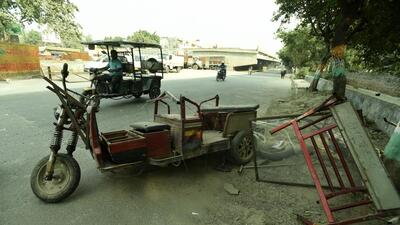 The mangled remains of an e-rickshaw after the SUV rammed into it, at Sector 44, in Noida on Tuesday. (Sunil Ghosh/HT Photo)