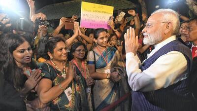 Prime Minister Narendra Modi being greeted by members of Indian diaspora in Bali on Monday. (PTI) Prime Minister Narendra Modi being greeted by members of Indian diaspora in Bali on Monday. (PTI)