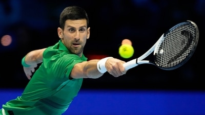 Serbia's Novak Djokovic returns the ball to Greece's Stefanos Tsitsipas during their singles tennis match of the ATP World Tour Finals, at the Pala Alpitour in Turin, Italy, Monday, Nov. 14, 2022.AP/PTI Photo(AP11_15_2022_000025B) (AP)