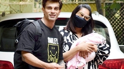 Bipasha Basu and Karan Singh Grover with their newborn daughter Devi outside their house on Tuesday. (Yogen Shah) Bipasha Basu and Karan Singh Grover with their newborn daughter Devi outside their house on Tuesday. (Yogen Shah)