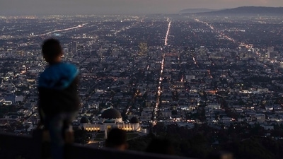 World Population: A boy takes in the view of the Los Angeles skyline. (AP) World Population: A boy takes in the view of the Los Angeles skyline. (AP)