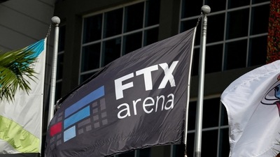 The logo of FTX is seen on a flag at the entrance of the FTX Arena in Miami, Florida. (REUTERS)
