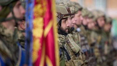 Russia-Ukraine War: Ukrainian serviceman standing in attention during Ukrainian President Volodymyr Zelensky's visit to the newly liberated city of Kherson. (AFP) Russia-Ukraine War: Ukrainian serviceman standing in attention during Ukrainian President Volodymyr Zelensky's visit to the newly liberated city of Kherson. (AFP)