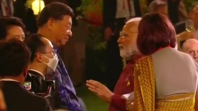 Prime Minister Narendra Modi with Chinese President Xi Jinping at the G20 dinner hosted by Indonesian President Joko Widodo in Bali on Tuesday. (Reuters Photo) Prime Minister Narendra Modi with Chinese President Xi Jinping at the G20 dinner hosted by Indonesian President Joko Widodo in Bali on Tuesday. (Reuters Photo)