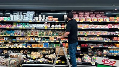 An employee stocks refrigerated items at a Grocery Outlet store in Pleasanton, Calif., on Thursday. (AP file) An employee stocks refrigerated items at a Grocery Outlet store in Pleasanton, Calif., on Thursday. (AP file)