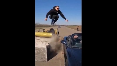 The image, taken from a video shared by Harsh Goenka, shows the man jumping out of the moving car to make a safe landing. (Twitter/@hvgoenka) The image, taken from a video shared by Harsh Goenka, shows the man jumping out of the moving car to make a safe landing. (Twitter/@hvgoenka)