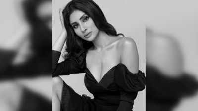 Mouni Roy's outfit includes a blouse featuring puff shoulders and a plunging neckline and a flowy skirt. (Instagram/@imouniroy)