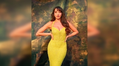Nora Fatehi flaunts her hourglass figure in this red-carpet-worthy gown featuring halter straps and a plunging neckline. (Instagram/@norafatehi) Nora Fatehi flaunts her hourglass figure in this red-carpet-worthy gown featuring halter straps and a plunging neckline. (Instagram/@norafatehi)