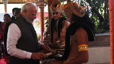 Modi playing drums at the event in Bali, Indonesia. (ANI) Modi playing drums at the event in Bali, Indonesia. (ANI)