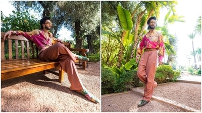 Recently, Ranveer Singh's stylist Eka Lakhani posted pictures of his two new looks on Instagram. The first set of photos shows Ranveer dressed in a rani pink shirt and mauve-coloured baggy pants. While the top comes adorned in multi-coloured floral patterns, full-length sleeves and front button closures, the bottoms have a high-rise waist, pleats on the front and floor-grazing hem. (Instagram) Recently, Ranveer Singh's stylist Eka Lakhani posted pictures of his two new looks on Instagram. The first set of photos shows Ranveer dressed in a rani pink shirt and mauve-coloured baggy pants. While the top comes adorned in multi-coloured floral patterns, full-length sleeves and front button closures, the bottoms have a high-rise waist, pleats on the front and floor-grazing hem. (Instagram)