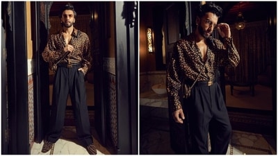 Ranveer styled the ensemble with a black embellished leather belt, gold and black embellished shoes, an animal-printed over-the-body bag, tinted sunglasses, and ear studs. In the end, Ranveer chose a side-parted hairdo, rugged beard and contoured face for the glam picks. Which look of the actor do you like the most? (Instagram) Ranveer styled the ensemble with a black embellished leather belt, gold and black embellished shoes, an animal-printed over-the-body bag, tinted sunglasses, and ear studs. In the end, Ranveer chose a side-parted hairdo, rugged beard and contoured face for the glam picks. Which look of the actor do you like the most? (Instagram)