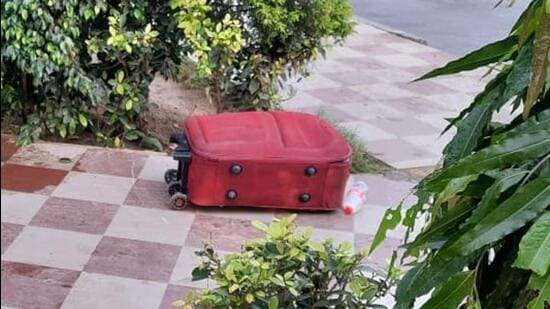 The red suitcase in which the man’s body was found outside Jalandhar City railway station on Tuesday. (HT Phone)