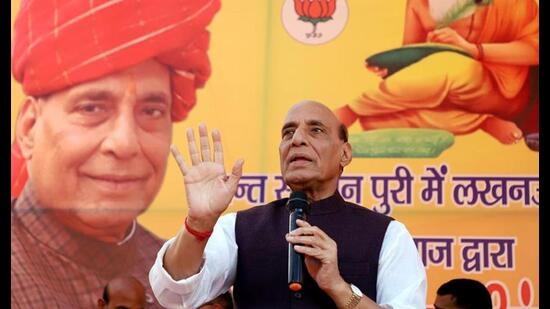 Defence minister Rajnath Singh interacts with the people of the Dhanuk Samaj at a programme, at Sudarshan Puri Colony, in Aishbagh ward, in Lucknow on Tuesday. (ANI Photo)