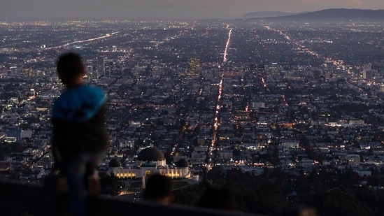 World Population: A boy takes in the view of the Los Angeles skyline.(AP)