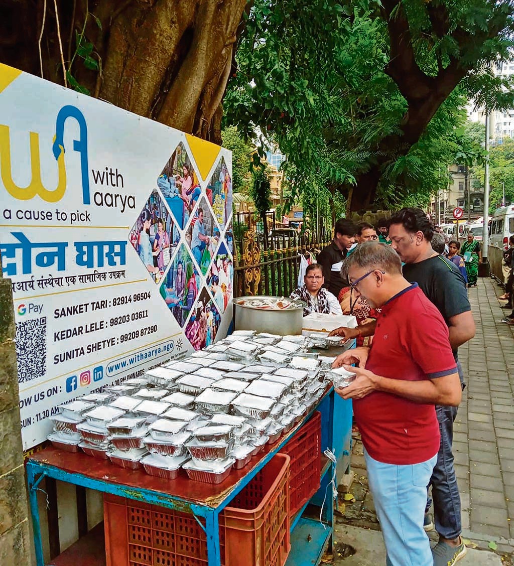 Volunteers distribute food outside government hospitals