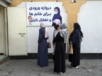 Afghan women stand outside an amusement park, in Kabul, Afghanistan, Thursday, Nov. 10, 2022. 