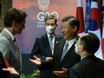 Canada's Prime Minister Justin Trudeau speaks with China's President Xi Jinping at the G20 Leaders' Summit in Bali, Indonesia. 