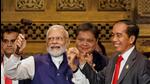 Indonesia’s President Joko Widodo hands over the G20 gavel to Prime Minister Modi in Bali. (AFP) Indonesia’s President Joko Widodo hands over the G20 gavel to Prime Minister Modi in Bali. (AFP)