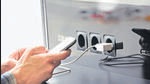 Airport public charger and man's hands with smartphone. Airplane in reflection. Using device in the journey. (Getty Images/iStockphoto) Airport public charger and man's hands with smartphone. Airplane in reflection. Using device in the journey. (Getty Images/iStockphoto)