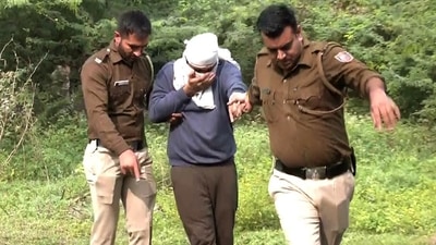 Delhi Police brings Aftab Poonawalla - accused in the Shraddha Walker murder case - to a jungle area to recover body parts. (ANI Photo) Delhi Police brings Aftab Poonawalla - accused in the Shraddha Walker murder case - to a jungle area to recover body parts. (ANI Photo)