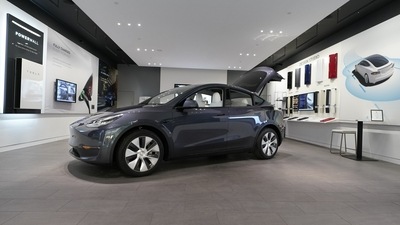 A Tesla Model Y Long Range is displayed at the Tesla Gallery in Troy. (AP) A Tesla Model Y Long Range is displayed at the Tesla Gallery in Troy. (AP)