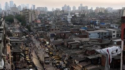 Mumbai, India - April 1, 2020: Small industries workers lineup for the food packets at Dharavi during restrictions on citizens' movement on account of Section 144 due to COVID 19 pandemic in Mumbai, India, on Wednesday, April 1, 2020. (Photo by Satish Bate/Hindustan Times) (Satish Bate/HT Photo) Mumbai, India - April 1, 2020: Small industries workers lineup for the food packets at Dharavi during restrictions on citizens' movement on account of Section 144 due to COVID 19 pandemic in Mumbai, India, on Wednesday, April 1, 2020. (Photo by Satish Bate/Hindustan Times) (Satish Bate/HT Photo)