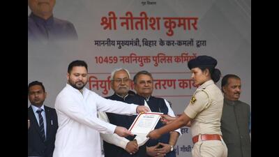 Bihar deputy CM Tejashwi Prasad Yadav along with CM Nitish Kumar distributes appointment letters to the newly appointment police personnel in Patna on Wednesday. (Santosh Kumar/HT Photo) Bihar deputy CM Tejashwi Prasad Yadav along with CM Nitish Kumar distributes appointment letters to the newly appointment police personnel in Patna on Wednesday. (Santosh Kumar/HT Photo)
