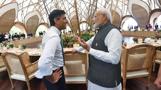 Prime Minister Narendra Modi interacts with his United Kingdom counterpart Rishi Sunak on the first day of the 17th G20 Summit, in Bali on Tuesday.
