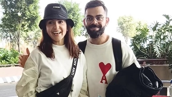 Anushka Sharma and Virat Kohli twin in black and white outfits at the airport. (HT Photo/Varinder Chawla)