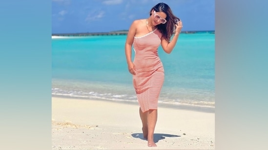 Recently, Hina Khan took to Instagram to share throwback pictures of herself from a recent holiday in the Maldives. The post shows Hina dressed in a hot thigh-slit dress and posing for the camera on the beach with clear blue skies and pristine water in the backdrop. "Kinda missing beaches #throwbacktuesday," Hina captioned the post.(Instagram)