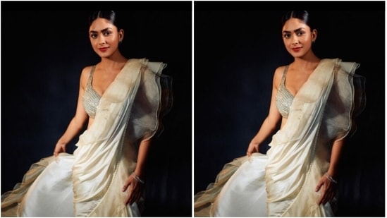 Styled by fashion stylist Sheefa J Gilani, Mrunal wore her tresses into a clean bun with a middle part as she posed for the pictures.(Instagram/@mrunalthakur)