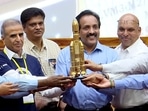 Indian Space Research Organisation (ISRO) Chairman S Somanath with others holds miniature model of rocket LVM3-M2. Indian Space Research Organisation (ISRO) Chairman S Somanath with others holds miniature model of rocket LVM3-M2.